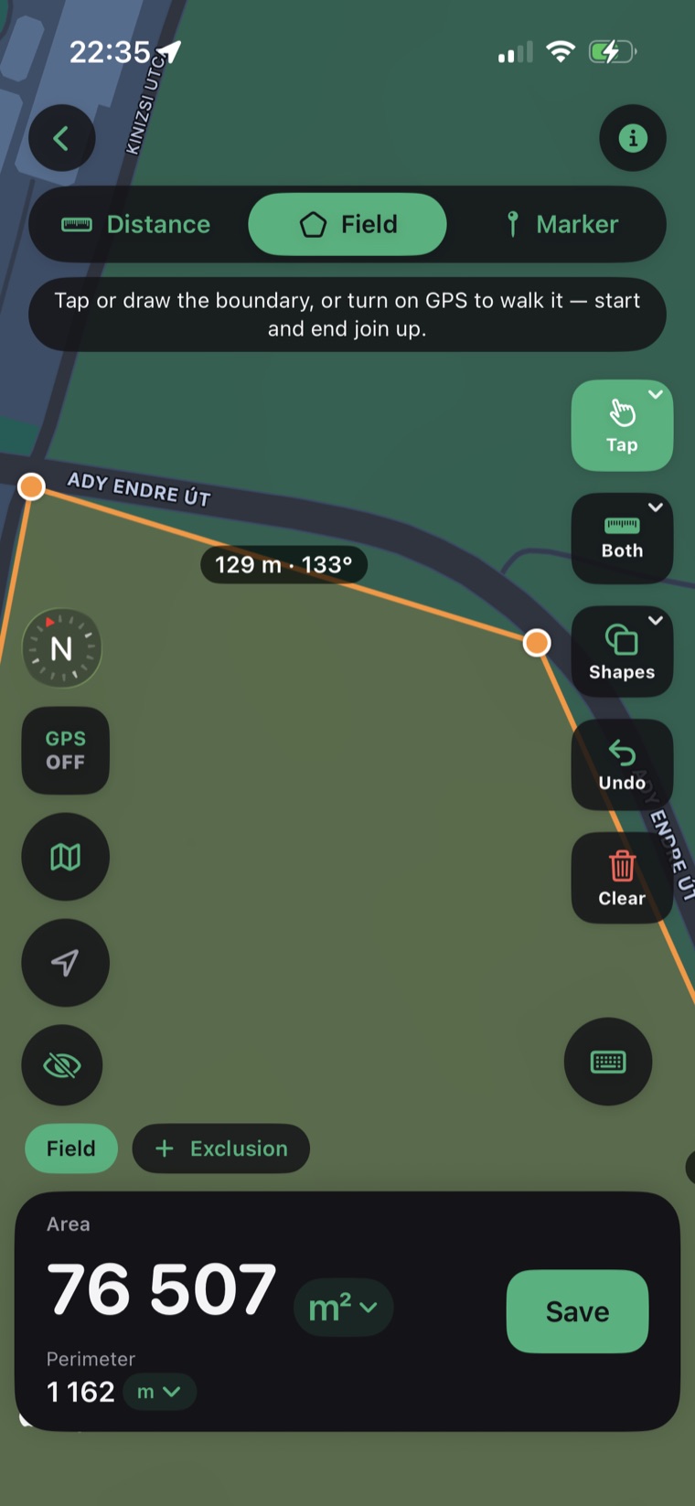 GPS & Area Measure app measuring a field — 76,507 m² area and 1,162 m perimeter on a satellite map